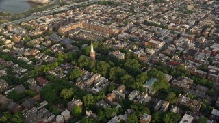 4.8K aerial stock footage approaching St Peter's Episcopal Church in an urban neighborhood at sunset, Philadelphia, Pennsylvania Aerial Stock Footage | AX80_028