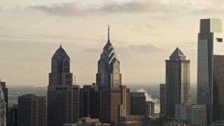 4.8K aerial stock footage of rooftops of One and Two Liberty Place, Philadelphia, Pennsylvania, Sunset Aerial Stock Footage | AX80_032