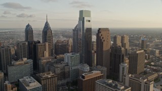 4.8K aerial stock footage flying by Downtown Philadelphia skyscrapers, Pennsylvania, Sunset Aerial Stock Footage | AX80_061