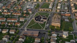 4.8K aerial stock footage of a community center and church in North Philadelphia, Pennsylvania Sunset Aerial Stock Footage | AX80_070