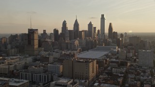 4.8K aerial stock footage approaching the Downtown Philadelphia skyline and convention center in Pennsylvania, Sunset Aerial Stock Footage | AX80_078E