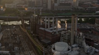 AX80_088 - 4.8K aerial stock footage of Veolia Energy power plant in South Philadelphia, Pennsylvania, Sunset