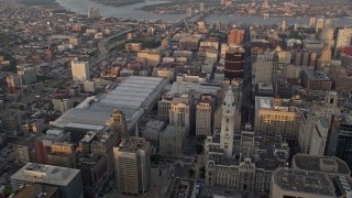 4.8K aerial stock footage flying over Downtown Philadelphia skyscrapers, to reveal Convention Center, City Hall in Pennsylvania, Sunset Aerial Stock Footage | AX80_095