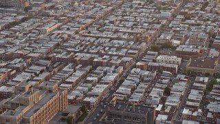 4.8K aerial stock footage of an urban neighborhood in South Philadelphia, Pennsylvania, Sunset Aerial Stock Footage | AX80_109E