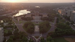 AX80_120E - 4.8K aerial stock footage tilting from Logan Square to reveal Philadelphia Museum of Art, Pennsylvania, Sunset