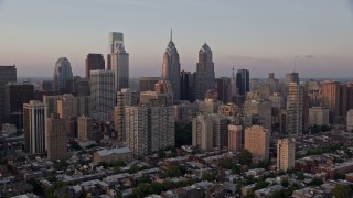 4.8K aerial stock footage flying by Downtown Philadelphia skyscrapers, Pennsylvania, Sunset Aerial Stock Footage | AX80_127E