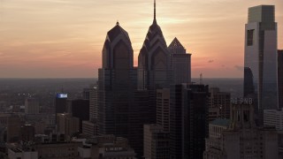 4.8K aerial stock footage of One and Two Liberty Place in Downtown Philadelphia, Pennsylvania, Sunset Aerial Stock Footage | AX80_157