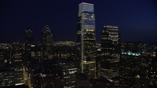 4.8K aerial stock footage flying by City Hall and Downtown Philadelphia's tallest skyscrapers, Pennsylvania, Night Aerial Stock Footage | AX81_021E