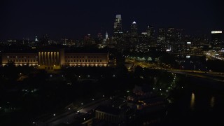 4.8K aerial stock footage flying by Philadelphia Museum of Art and approach Downtown Philadelphia skyline, Pennsylvania, Night Aerial Stock Footage | AX81_030