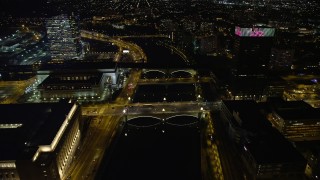 AX81_071E - 4.8K aerial stock footage of small bridges spanning Schuylkill River by office buildings, approach Philadelphia Museum of Art, Pennsylvania Night