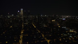 4.8K aerial stock footage of Downtown Philadelphia high-rises and skyscrapers in Pennsylvania, Night Aerial Stock Footage | AX81_079E