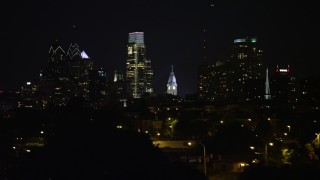 4.8K aerial stock footage of Downtown Philadelphia skyline seen from Delaware River, Pennsylvania, Night Aerial Stock Footage | AX81_094