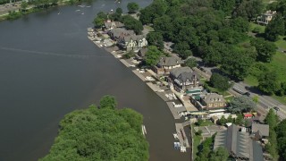 4.8K aerial stock footage flying over Boathouse Row by the Schuylkill River, Philadelphia, Pennsylvania Aerial Stock Footage | AX82_020