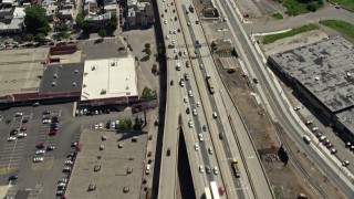 4.8K aerial stock footage tilting from Interstate 95 with light traffic to reveal industrial buildings in North Philadelphia, Pennsylvania Aerial Stock Footage | AX82_027