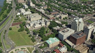 AX82_072E - 4.8K aerial stock footage flying over government buildings to approach the New Jersey State House in Trenton, New Jersey