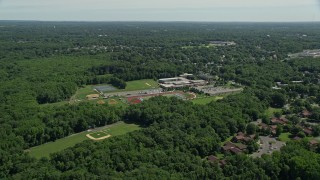 AX82_078 - 4.8K aerial stock footage flying over Notre Dame High School and football field in Lawrence Township, New Jersey