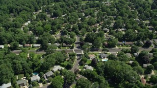 4.8K aerial stock footage flying over suburban neighborhoods among trees, Lawrenceville, New Jersey Aerial Stock Footage | AX82_080