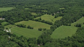 4.8K aerial stock footage of upscale homes by farm fields, Belle Mead, New Jersey Aerial Stock Footage | AX83_006