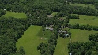 4.8K aerial stock footage of upscale homes and green fields in Belle Mead, New Jersey Aerial Stock Footage | AX83_007