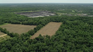 AX83_010 - 4.8K aerial stock footage of farm fields near a quarry in Kingston, New Jersey