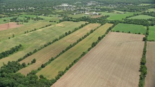 AX83_043 - 4.8K aerial stock footage of farmland near barns in Somerset, New Jersey