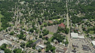 AX83_056 - 4.8K aerial stock footage flying over suburban homes and reveal sports field, South Plainfield, New Jersey