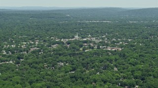 4.8K aerial stock footage of a church steeple rising above buildings in small town of Westfield, New Jersey Aerial Stock Footage | AX83_061