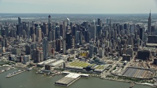 AX83_111E - 4.8K aerial stock footage flying by the Hudson Yards and Hell's Kitchen areas of Midtown Manhattan, New York City