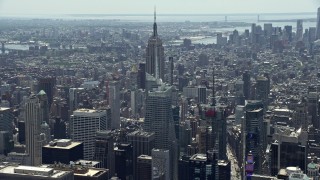 4.8K aerial stock footage approaching Empire State Building and Bank of America Tower, Midtown Manhattan, New York City Aerial Stock Footage | AX83_142