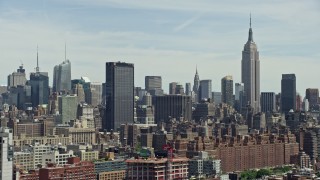 AX83_150 - 4.8K aerial stock footage of One Penn Plaza, Empire State Building and Midtown Manhattan skyscrapers, New York City