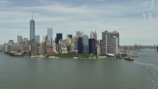 AX83_175 - 4.8K aerial stock footage of Lower Manhattan skyline and Battery Park in New York City