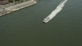 4.8K aerial stock footage tracking a ferry cruising on the East River, New York City Aerial Stock Footage | AX83_181