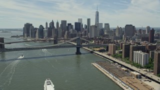 4.8K aerial stock footage of Brooklyn and Manhattan Bridges, and the Lower Manhattan skyline, New York City Aerial Stock Footage | AX83_182