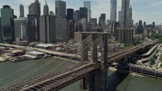 4.8K aerial stock footage of Brooklyn Bridge near the Lower Manhattan skyline, New York City Aerial Stock Footage | AX83_188