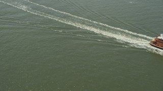 4.8K aerial stock footage of Staten Island Ferry sailing New York Harbor, New York Aerial Stock Footage | AX83_200