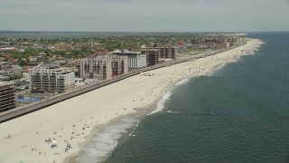 4.8K aerial stock footage flying by Beachfront Condominiums, Long Beach, New York Aerial Stock Footage | AX83_240