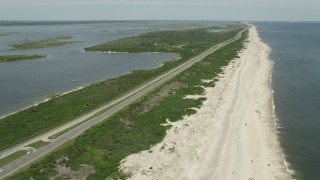 4.8K aerial stock footage flying by Light Traffic on Ocean Parkway, Wantagh, New York Aerial Stock Footage | AX83_254