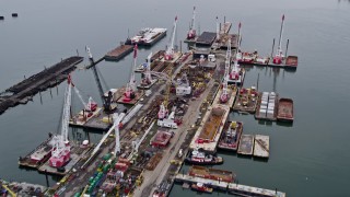 4K aerial stock footage Flying over a port, tilt up to reveal New York Harbor, Jersey City, New Jersey Aerial Stock Footage | AX84_002