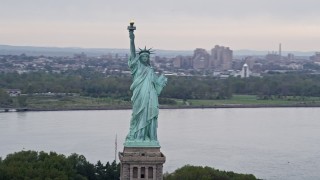 4K aerial stock footage Flying by the Statue of Liberty, New York, New York Aerial Stock Footage | AX84_005