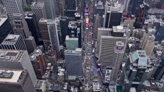 4K aerial stock footage fly over Times Square and tilt to a bird's eye view, Midtown Manhattan, New York City Aerial Stock Footage | AX84_050E