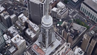 4K aerial stock footage approach top of Empire State Building, tilt to bird's eye view, Midtown Manhattan, New York City Aerial Stock Footage | AX84_074E