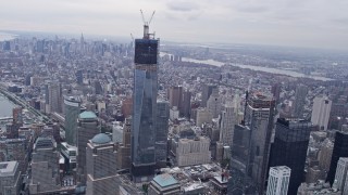 4K aerial stock footage tilt from Lower Manhattan, reveal One World Trade Center, New York, New York Aerial Stock Footage | AX84_089E