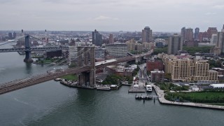 4K aerial stock footage approach Brooklyn Bridge, pan to Brooklyn buildings, New York City Aerial Stock Footage | AX84_116E