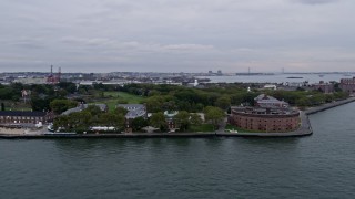 4K Aerial Video Flying by Castle Williams, Governors Island, New York Harbor, New York, New York Aerial Stock Footage | AX84_161