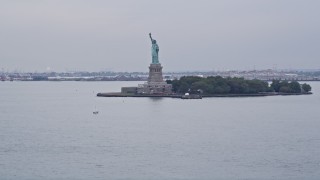 4K Aerial Video Tilting up to Statue of Liberty from New York Harbor, New York, New York Aerial Stock Footage | AX84_162