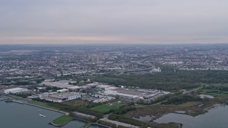 4K Aerial Video Flying by warehouses, Jersey City, New Jersey Aerial Stock Footage | AX84_168