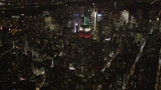 4K aerial stock footage Reveal Empire State Building, Midtown Manhattan, New York, New York, night Aerial Stock Footage | AX85_049