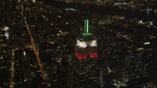 4K aerial stock footage Flying by the Empire State Building, Midtown Manhattan, New York, New York, night Aerial Stock Footage | AX85_053