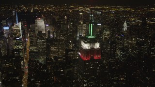 4K aerial stock footage Flying by Empire State Building, revealing Times Square, New York, New York, night Aerial Stock Footage | AX85_057