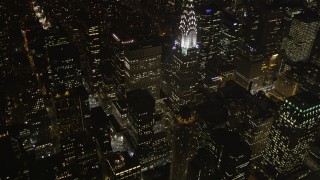 AX85_067 - 4K aerial stock footage Tilt up to reveal Chrysler Building, Midtown Manhattan, New York, New York, night